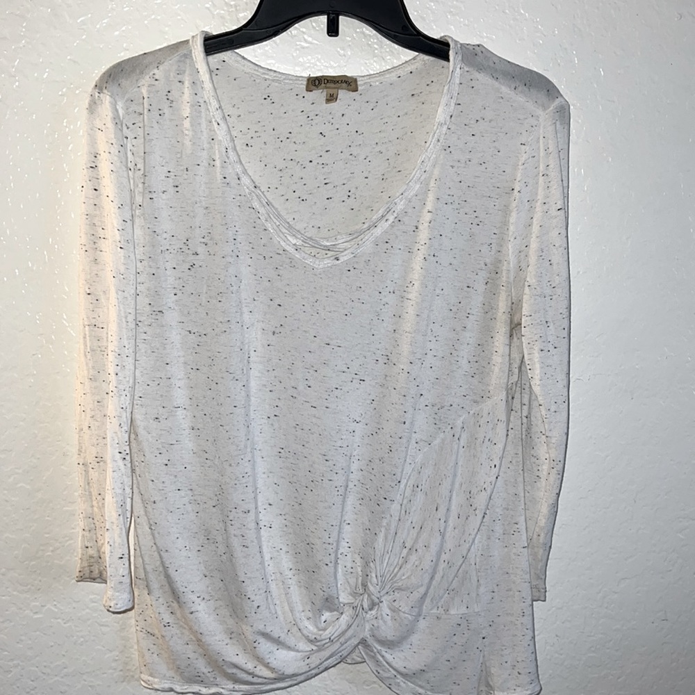 Woman’s white with small black dots blouse